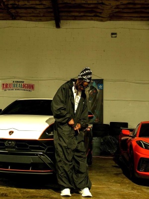 2 Chainz Wearing A Balenciaga Beanie Jumpsuit And Adidas Track Sneakers