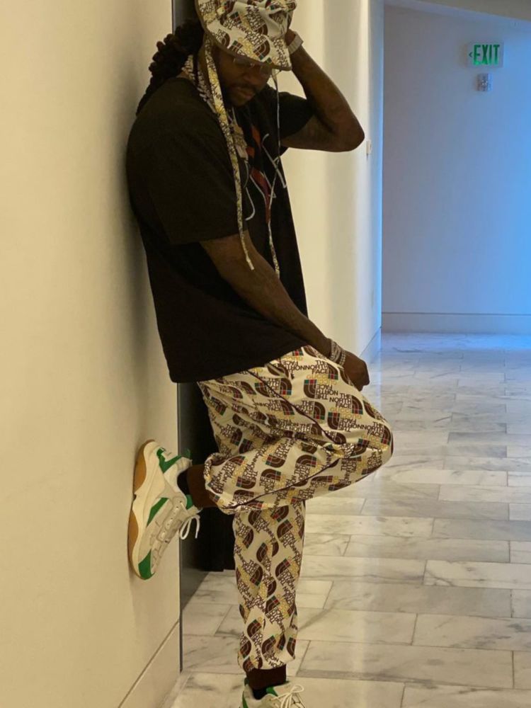 2 Chainz Wearing a White Gucci x The North Face, & Amiri Outfit