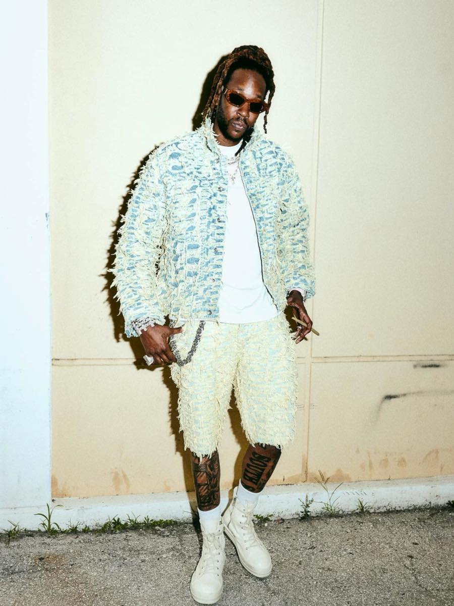 2 Chainz Wearing a Shredded Denim Jacket & Shorts With Rick Owens High-Tops