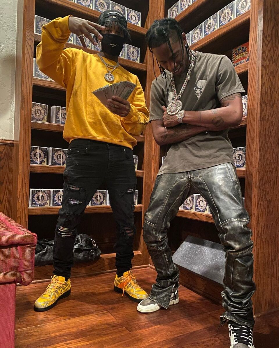 Travis Scott Wearing a Double-Skull Print Tee With Distressed Leather Pants