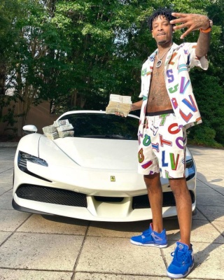 21 Savage Wearing A Louis Vuitton X Nba White And Multicolor Shirt And Shorts With Jordan X Florida Gators Sneakers