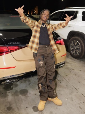 42 Dugg Wearing A Brown Flannel Chrome Hearts Shirt And Pats With Timberland Boots
