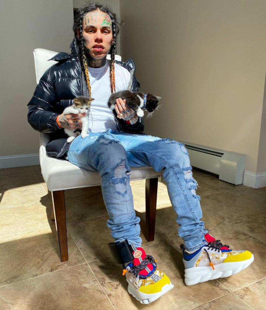 6ix9ine Holds Kittens In a Moncler Puffer & Versace Sneakers