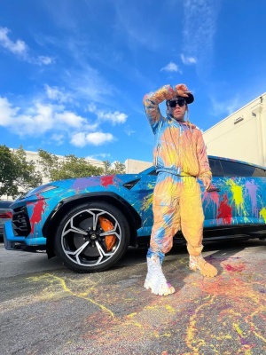 6ix9ine Wearing A Moncler Grenoble Light Blue Jacket And Matching Pants With Prada Boots