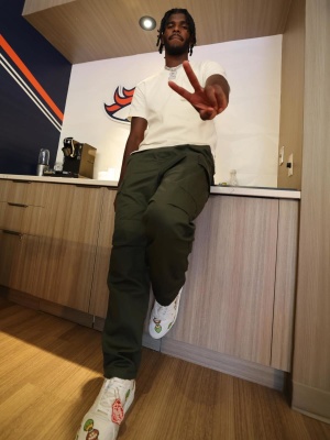 Shadeur Sanders Wearing A Louis Vuitton 3d Pocket Tee With Olive Cargo Pants And Lv X Nigo Duck Sneakers