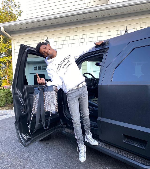 A Boogie Hanging Out Of His Rhino GX In a Dior Hoodie & High-Tops With a Chanel Belt