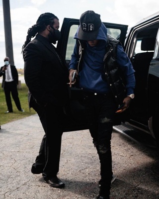 A Boogie Wearing A Dior X Kenny Scharf Hat With A Chrome Hearts Puffer Vest Tier Nyc Hoodie Amiri Jeans And Dior Sandals