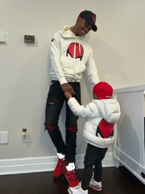 A Boogie Wearing An Amiri X Wes Lang Trucker Hat With A Moncler X Spiderman Hoodie Amiri Mx1 Jeans And Jordan 5 Sneakers