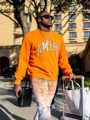 Aj Brown Wearing A Amiri Sweatshirt Allover Print Jeans And Louis Vuitton Bags