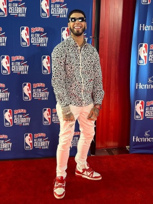 Anuel Aa Wearing A Louis Vuitton X Yk Dotted Zip Shirt With Amiri Mx1 Jeans And Louis Vuitton Sneakers
