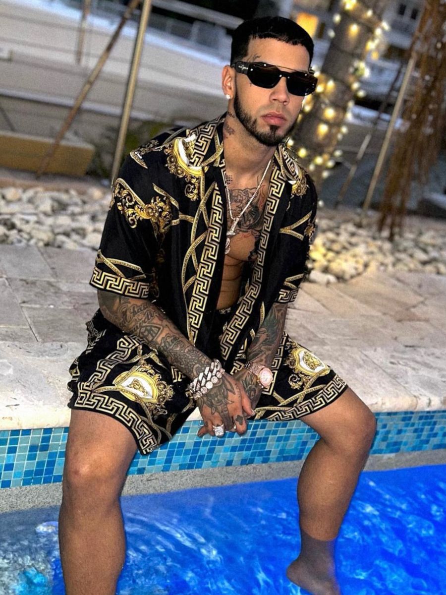 Anuel AA Switches It Up In a Versace Sunglasses & Medusa Print Outfit