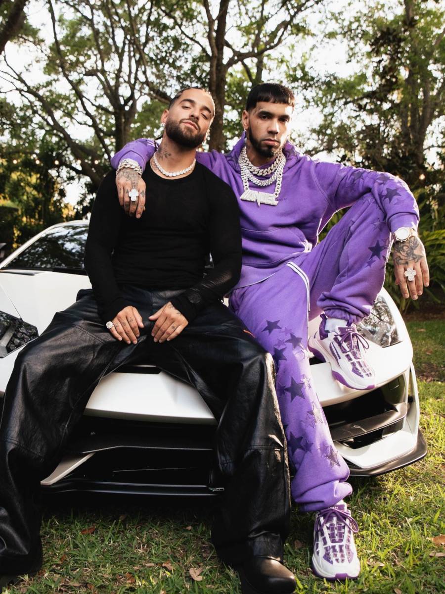 Anuel AA Wearing Amiri Purple Star Patch Sweats With Skeleton Patch Sneakers
