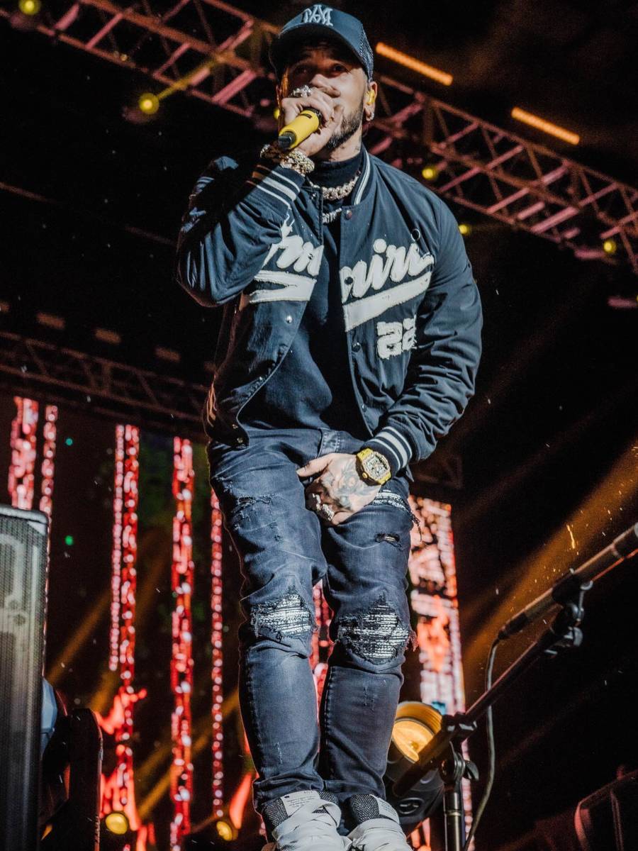 Anuel AA Performs In an All Black Amiri '22' Jacket & Boucle Jeans Outfit