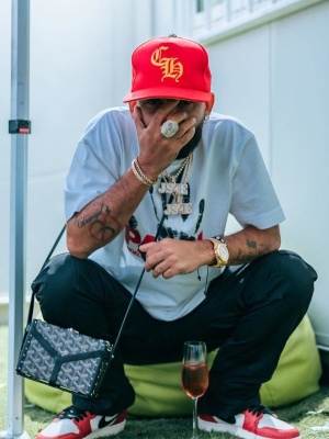 Arcangel Wearing A Chrome Hearts Hat With A Palm Angels Tee Goyard Bag And Jordan 1 Sneakers