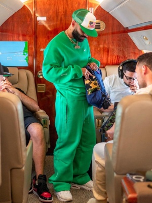 Arcangel Wearing A Nike X Nocta Green Sweatshirt And Pants With A Bape Backpack