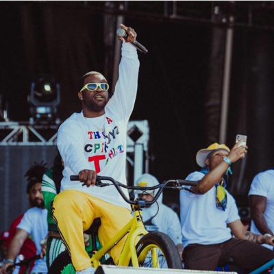 Asap Ferg Wearing A White This Is A Cpfm.xyx Shirt And Yellow Adidas Pants At Somethings In The Water Fest 2019