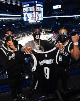 Bobby Shmurda Wearing A Brooklyn Nets Sweatshirt With Amiri Jeans And Louis Vuitton X Nba Jeans