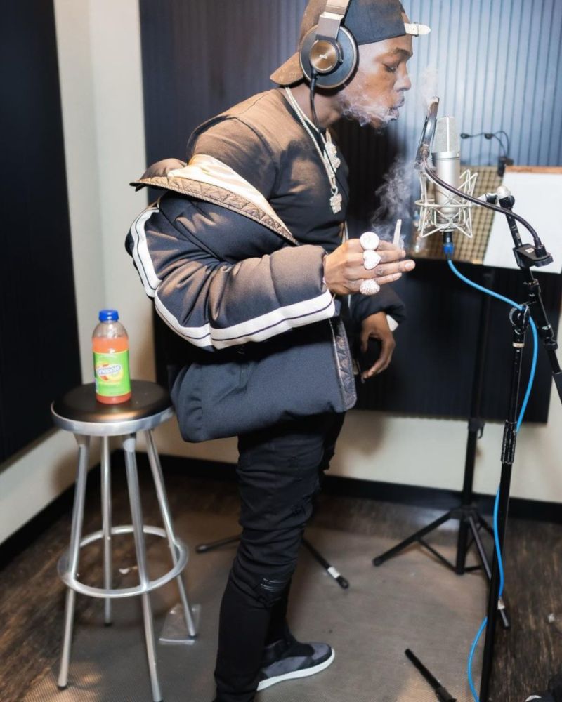 Bobby Shmurda Wearing a Louis Vuitton Hat & Sneakers with a Palm Angels x Moncler Puffer
