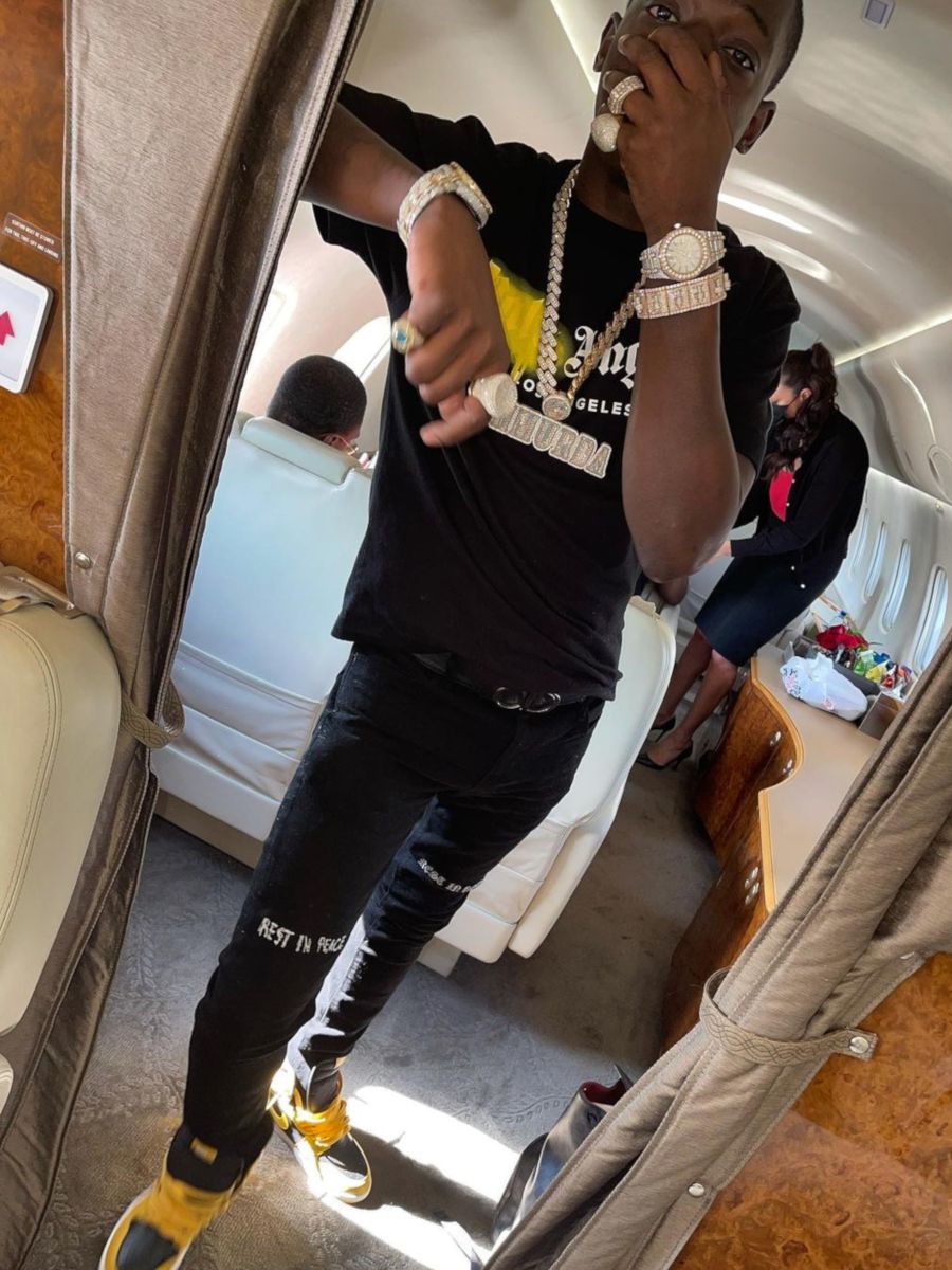 Bobby Shmurda Wearing a Palm Angels Tee With 'RIP' Jeans & Nike Dunks