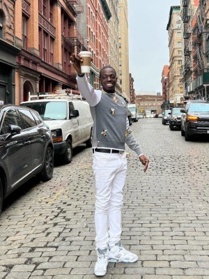 Bobby Shmurda Wearing A Thom Browne Sweater With Rta Jeans And Jordan Sneakers