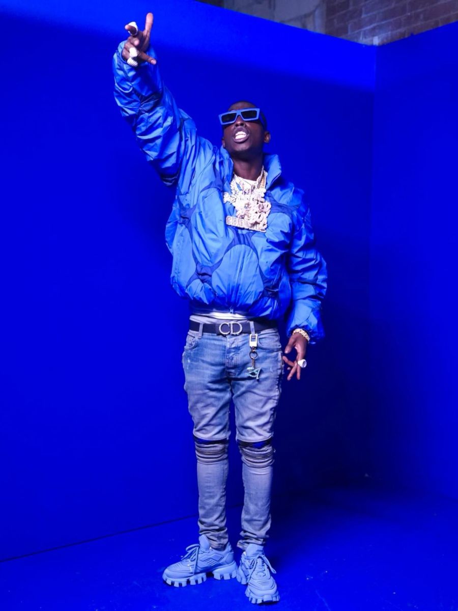 Bobby Shmurda Wearing a Post Archive Faction Puffer With Amiri Jeans & Prada Sneakers
