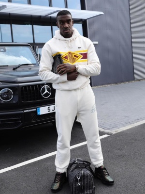 Bugzy Malone Wearing A Lacoste White Logo Stripe Hoodie And Joggers With Black Monogram Bags