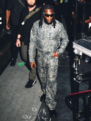 Burna Boy Wearing A Louis Vuitton Monogram Denim Jacket And Jeans With A Black Leather Lv Logo Belt