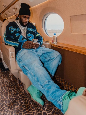 Burna Boy Wearing A Supreme Navy Knit Zip Hoodie Blue Baggy Carpenter Jeans And All Green Timberland Boots