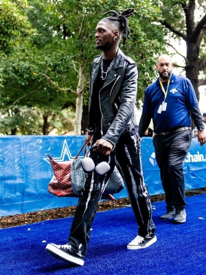 Ceedee Lamb Wearing An Amiri Biker Jacket With Bleached Crystal Jeans Black Canvas Sneakers And Goyard Bags