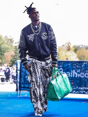Ceedee Lamb Wearing An Amiri Records Jacket With Tie Dye Paisley Cargo Pants And Patent Black Sneakers