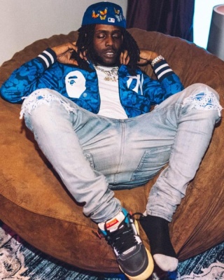 Chief Kee Wearing A Bape X Nyy Bomber Jacket With Amiri Jeans And Jordan X Union Sneakers