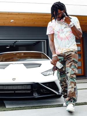 Chief Keef Wearing A Gallery Dept Tie Dye Tee With Gallery Dept Camo Pants And Amiri Sneakers