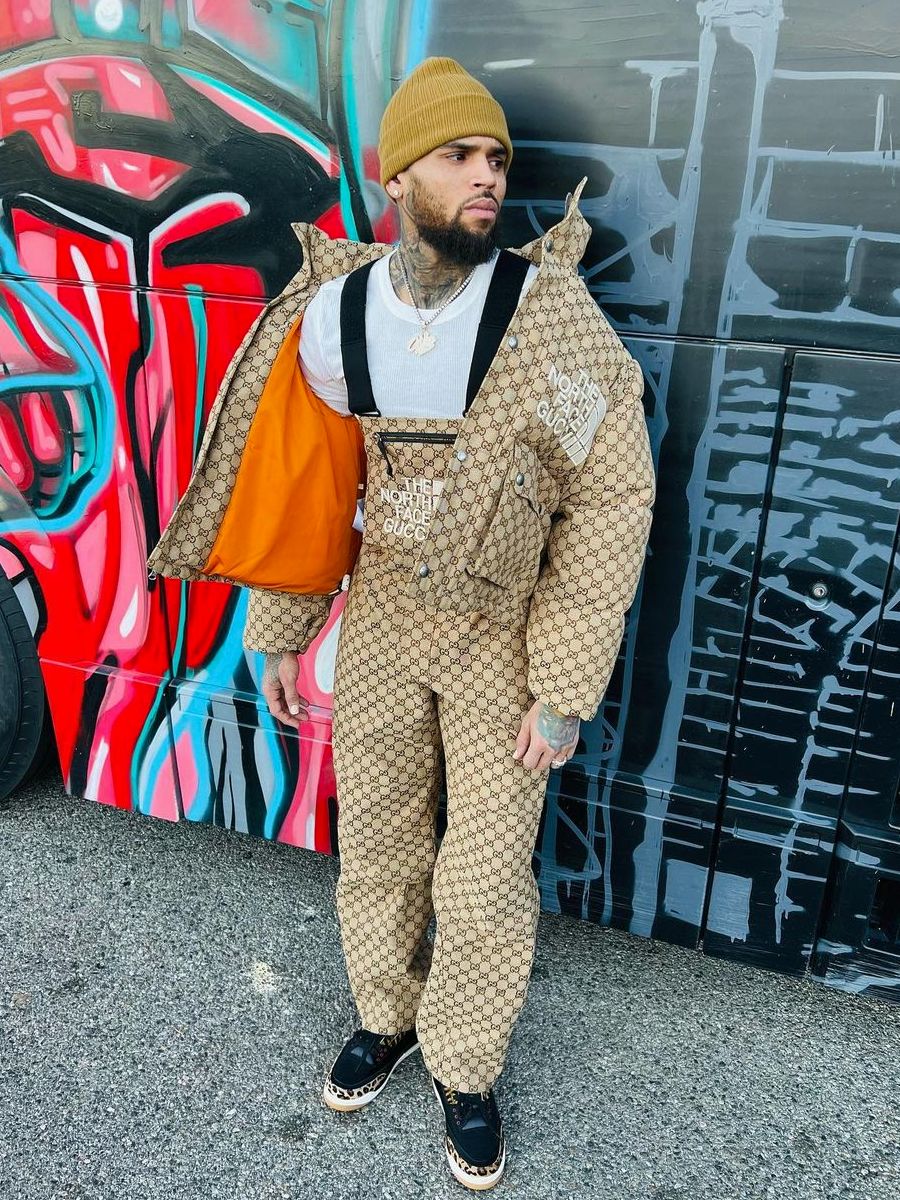 Chris Brown Wearing a Gucci x TNF Puffer Jacket & Matching Overalls