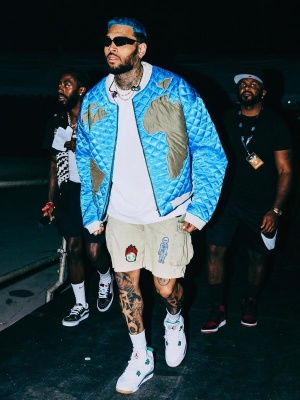 Chris Brown Wearing A Who Decides War Quilted Jacket With Gallery Dept Shorts And Jordan Sneakers