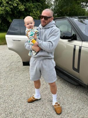 Conor Mcgregor Louis Vuitton Sunglasses Nike Grey Hoodie Grey Shorts Prada Mules
