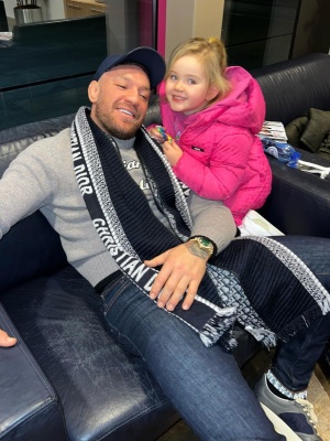 Conor Mcgregor Wearing A Dior Hat Sweater Scarf And Jeans With Gucci Sneakers
