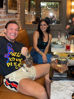 Conor Mcgregor Wearing A Gucci Lovers Club Tee And White Web Stripe Shorts