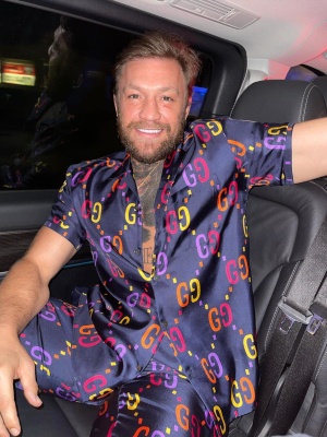 Conor Mcgregor Wearing A Gucci Navy And Multicolor Gg Silk Shirt And Shorts
