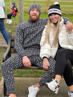 Conor Mcgregor Wearing A Prada Navy And White Allover Logo Beanie Sweater Joggers And Prax 01 Sneakers