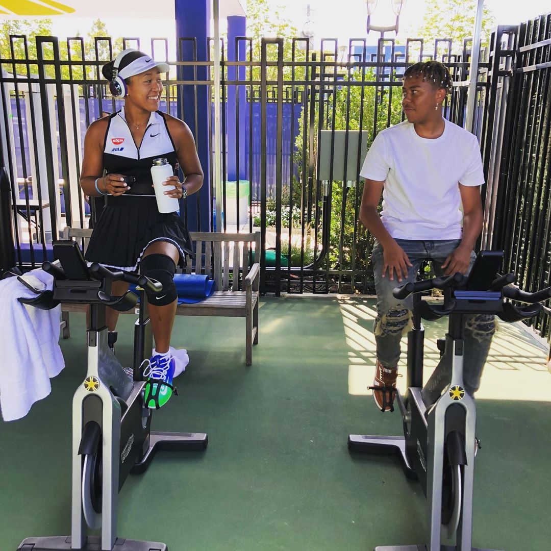 Cordae Works Out With Naomi Osaka In Amiri Jeans & LV Sneakers