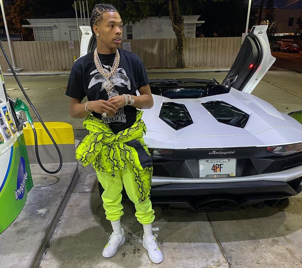 Lil Baby Fills Up His Aventador In An Off-White Python Puffer, Palm Angels Tee, & Martine Rose Sweats