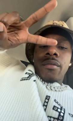Dababy Wearing A Gucci Bucket Hat With A Celine Studded Logo Sweater