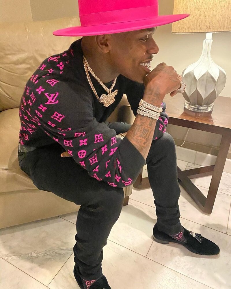 DaBaby Wears Matching Black and Pink Louis Vuitton Sweater, Gucci Socks, & Fedora