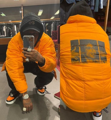 Dababy Wearing An Amiri Hat With A Supreme Puffer Nike X Stussy Black Padded Pants And Bape Shark Patent Sneakers