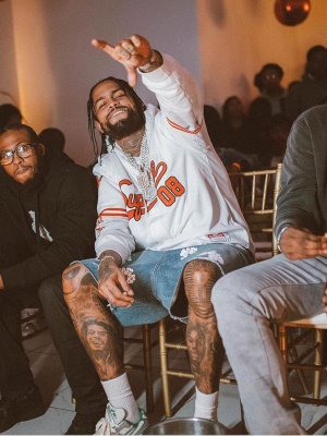 Dave East Wearing A Supreme Baseball Jersey With Denim Tears Shorts And Asics Sneakers