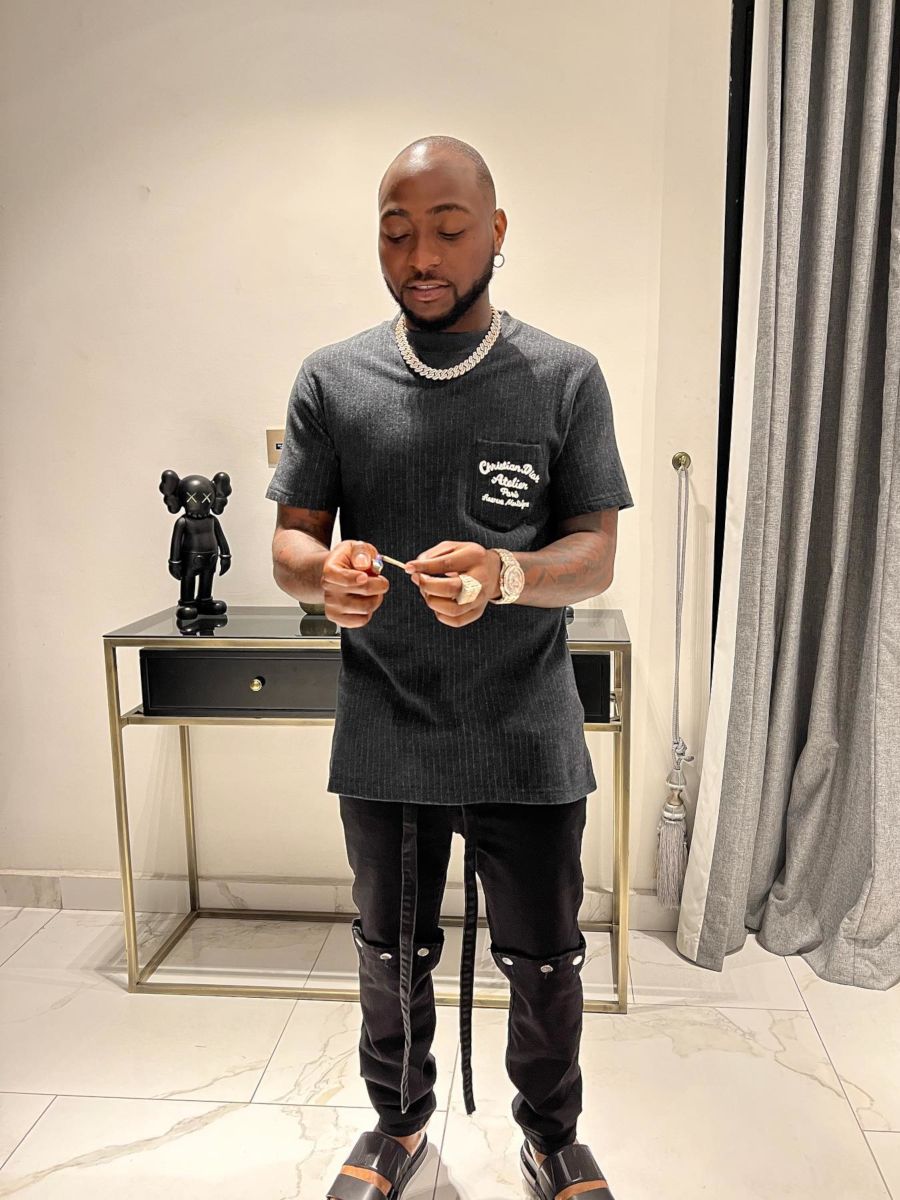 Davido Wearing a Dior Pinstriped T-Shirt With Valentino Sandals