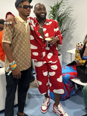 Davido Wearing A Loewe Red And White Dot Shirt And Shorts With Lv Sneakers