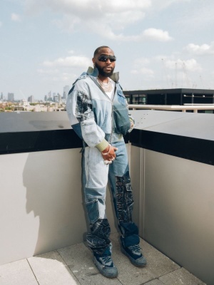 Davido Wearing An Agr Patchwork Denim Jacket And Jeans With Frameless Sunglasses