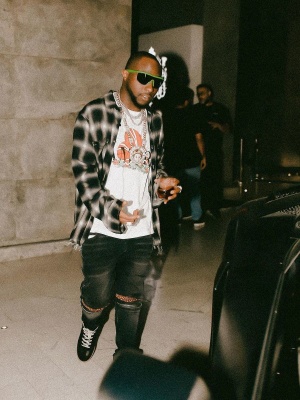 Davido Wearing An Amiri Flannel Shirt And Broken Heart Tee With Velvet Mx2 Jeans And Bottega Sneakers