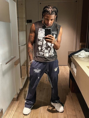Ddg Wearing A Gallery Dept Sleeveless Doc Johnson T Shirt With Navy Sweatpants And Off White Sneakers